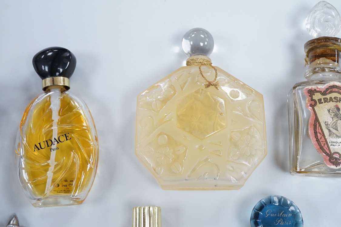 A Baccarat Guerlain perfume bottle in original box and a collection of other empty perfume bottles
